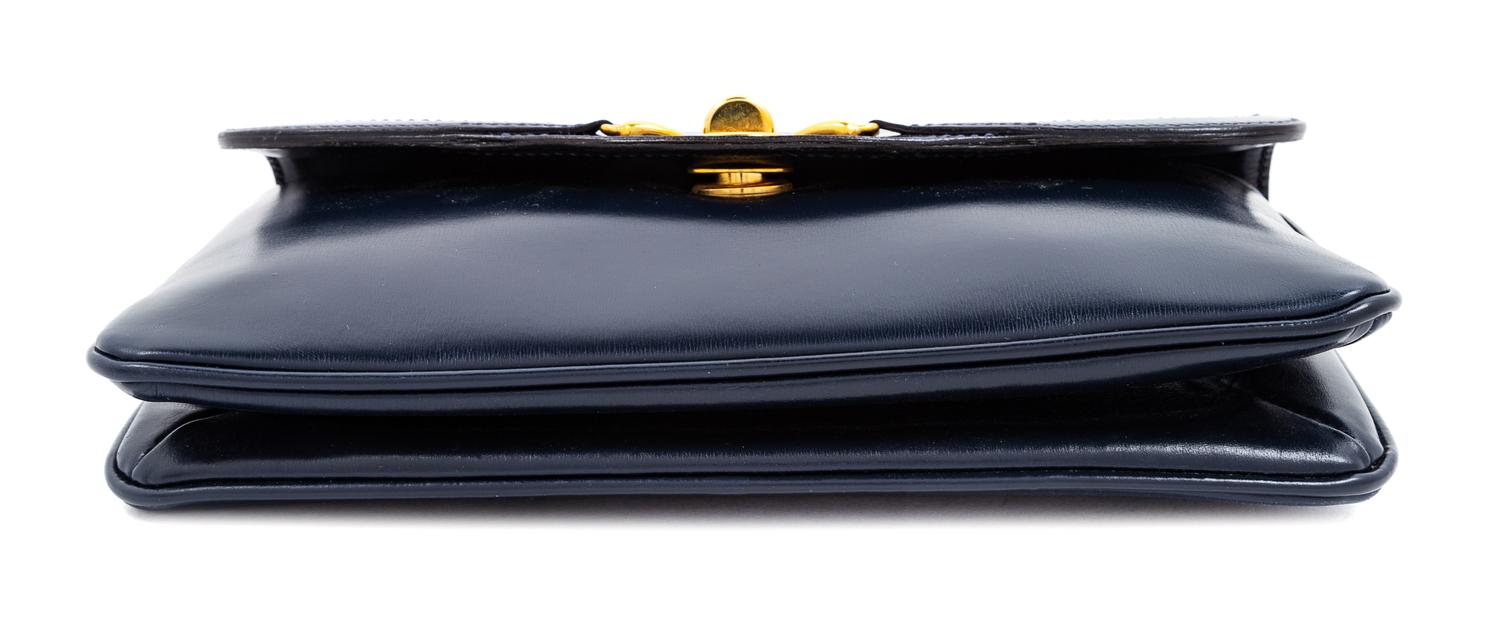 A Gucci Navy Leather Vintage Rectangular Clutch, 5.5" H x 10" W x 1" D.