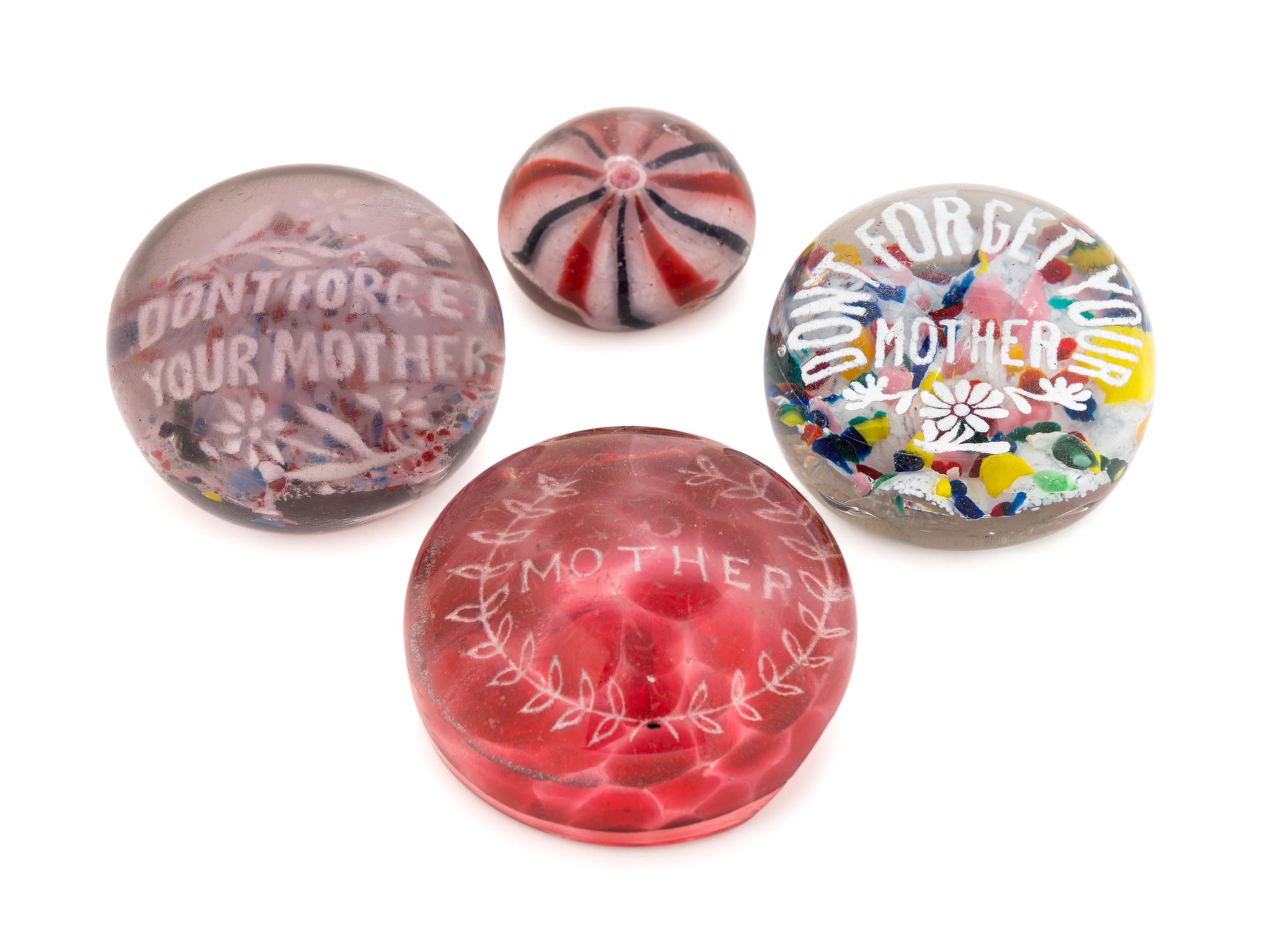 Three American Frit Mother Motto Glass Paperweights and a Two-Color Crown Glass Paperweight