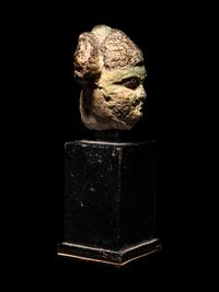 An Egyptian Faience Head of a Concubine