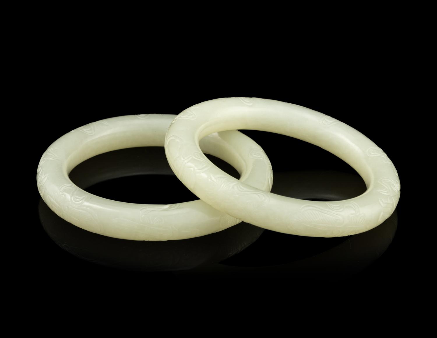 A Pair of Carved White Jade Bangles