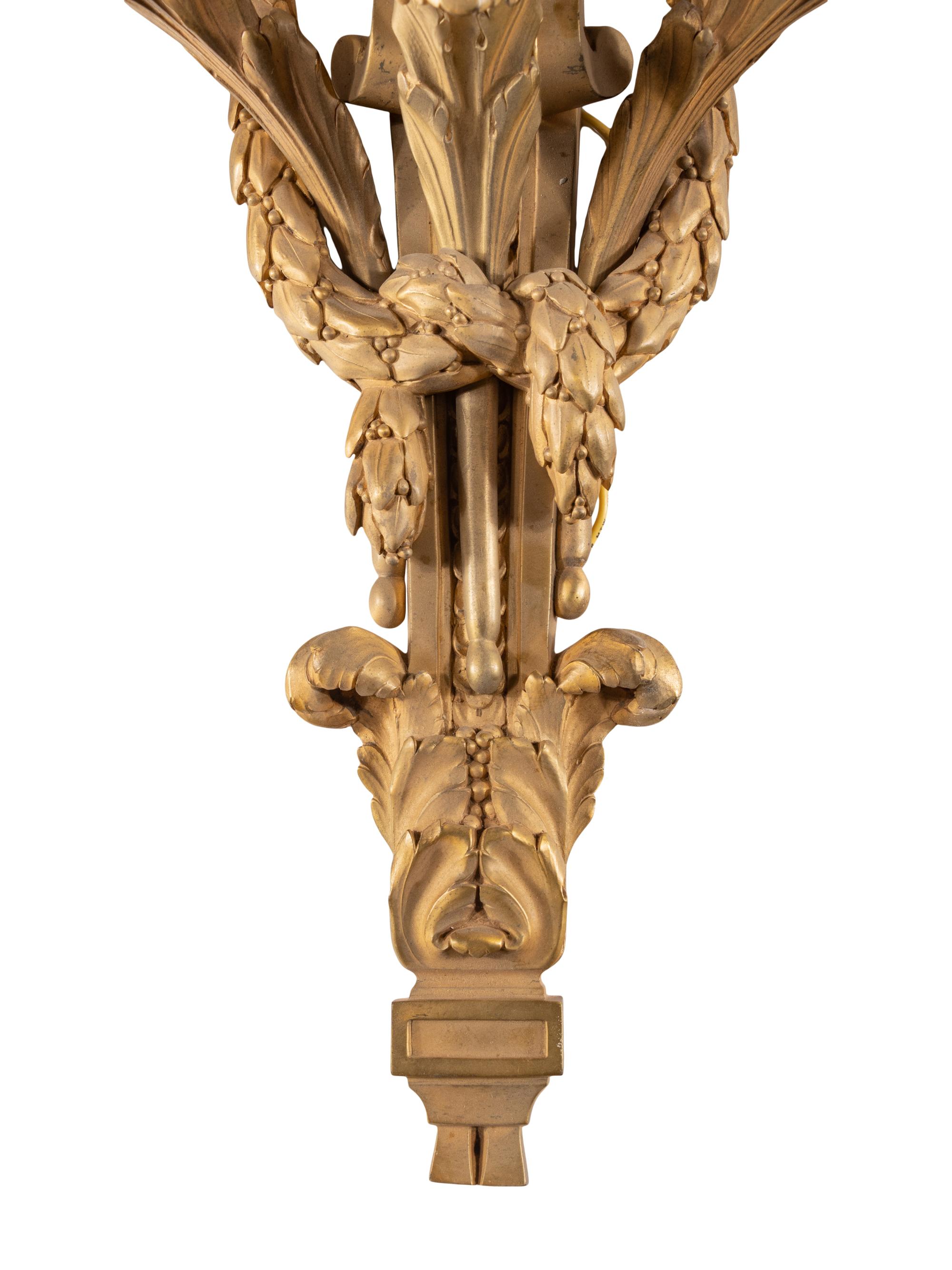 A Set of Eight Louis XVI Style Gilt Bronze Three-Light Sconces