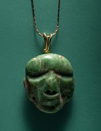 A Chontal Jade Maskette Pendant Necklace with Gold Chain