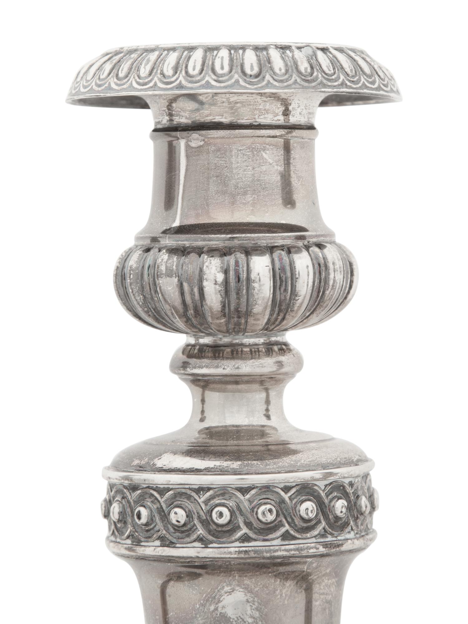 A Set of Four Victorian Silver Candlesticks