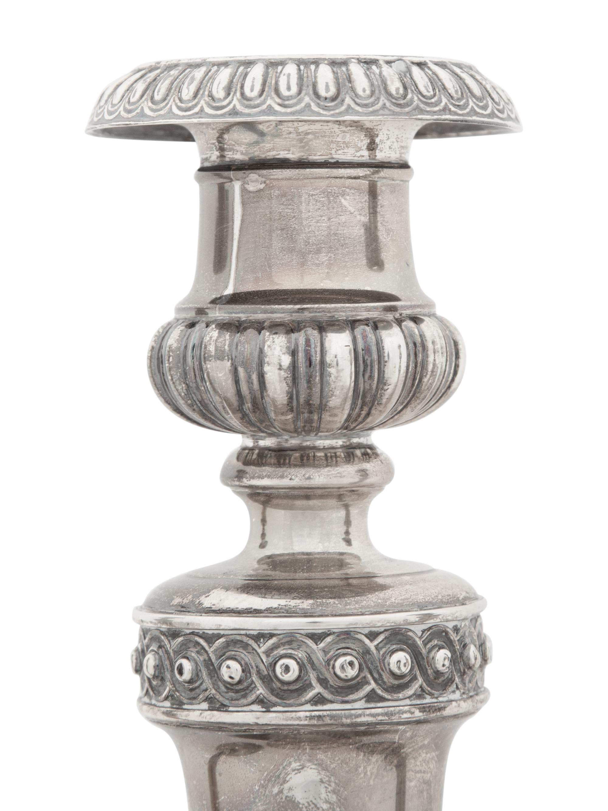 A Set of Four Victorian Silver Candlesticks