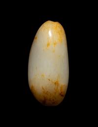 A Chinese Russet and White Jade Pebble-Form Snuff Bottle