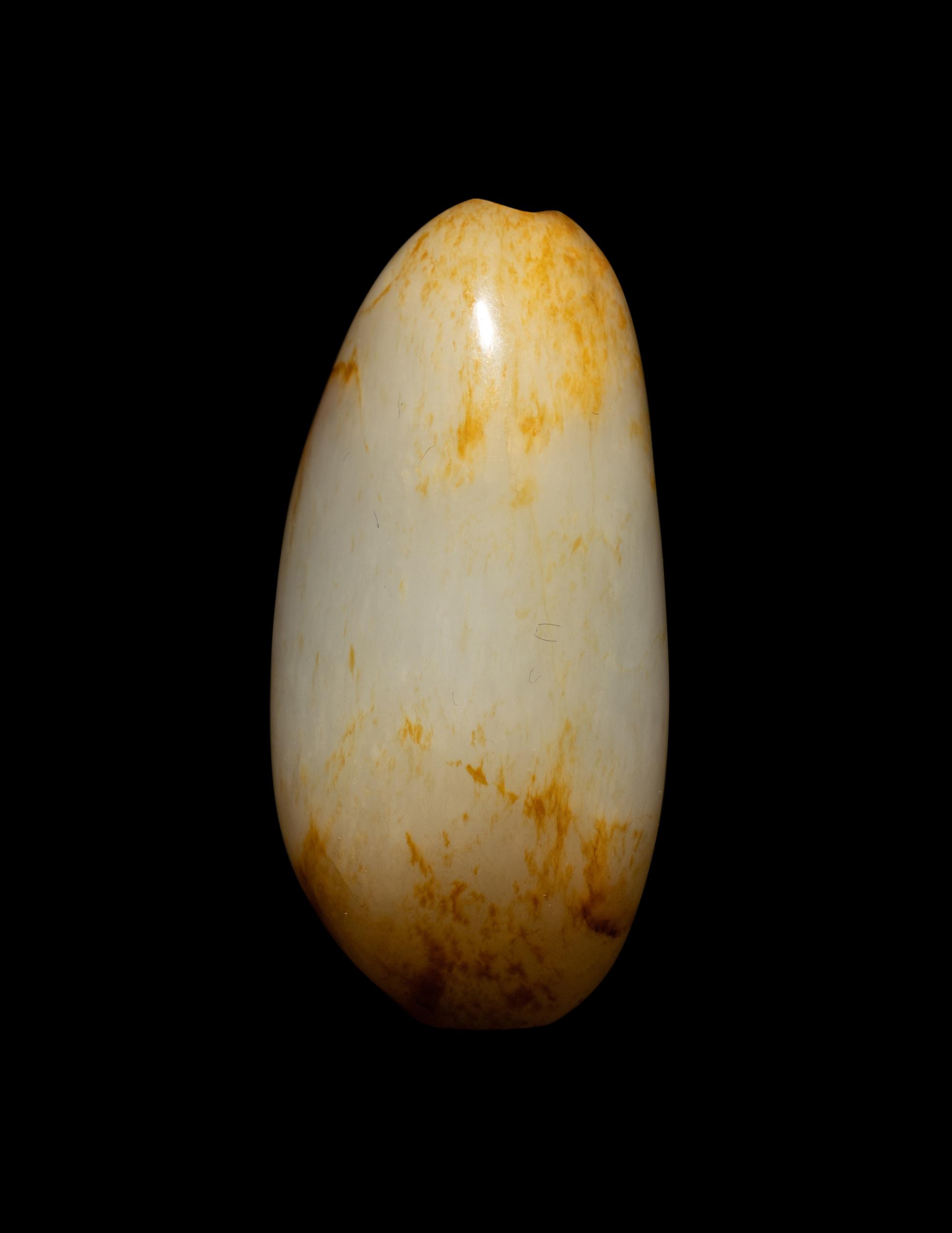 A Chinese Russet and White Jade Pebble-Form Snuff Bottle