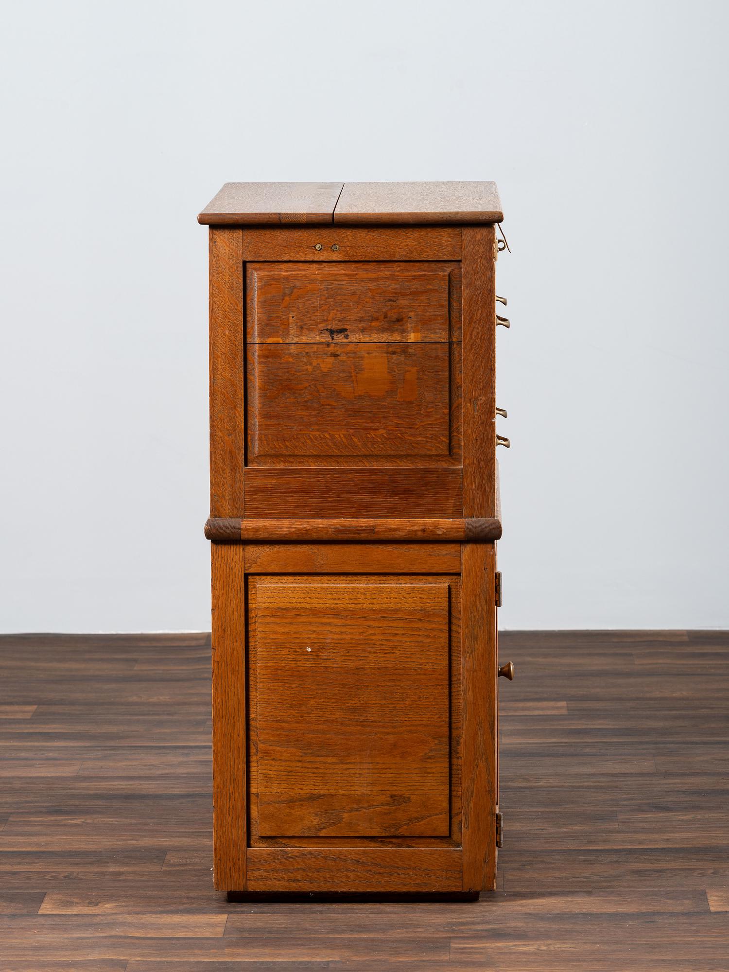 A Dental Student's Brass Mounted Oak Lift Top Cabinet