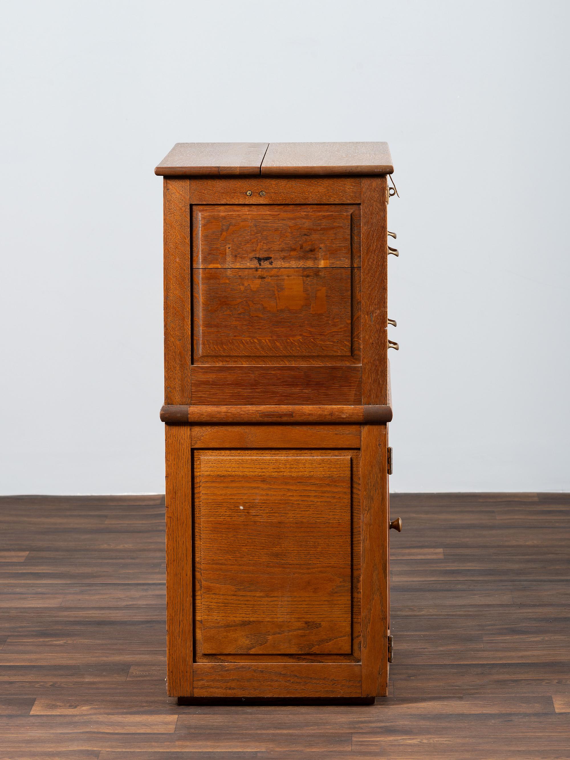 A Dental Student's Brass Mounted Oak Lift Top Cabinet