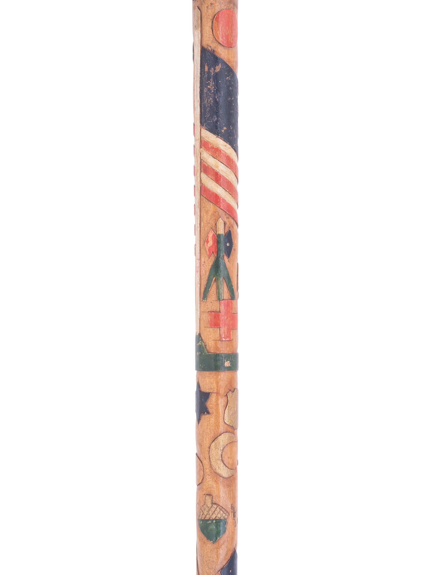 [CIVIL WAR]. Folk-art carved polychrome walking stick with patriotic motifs, incl. Army Corps badges.