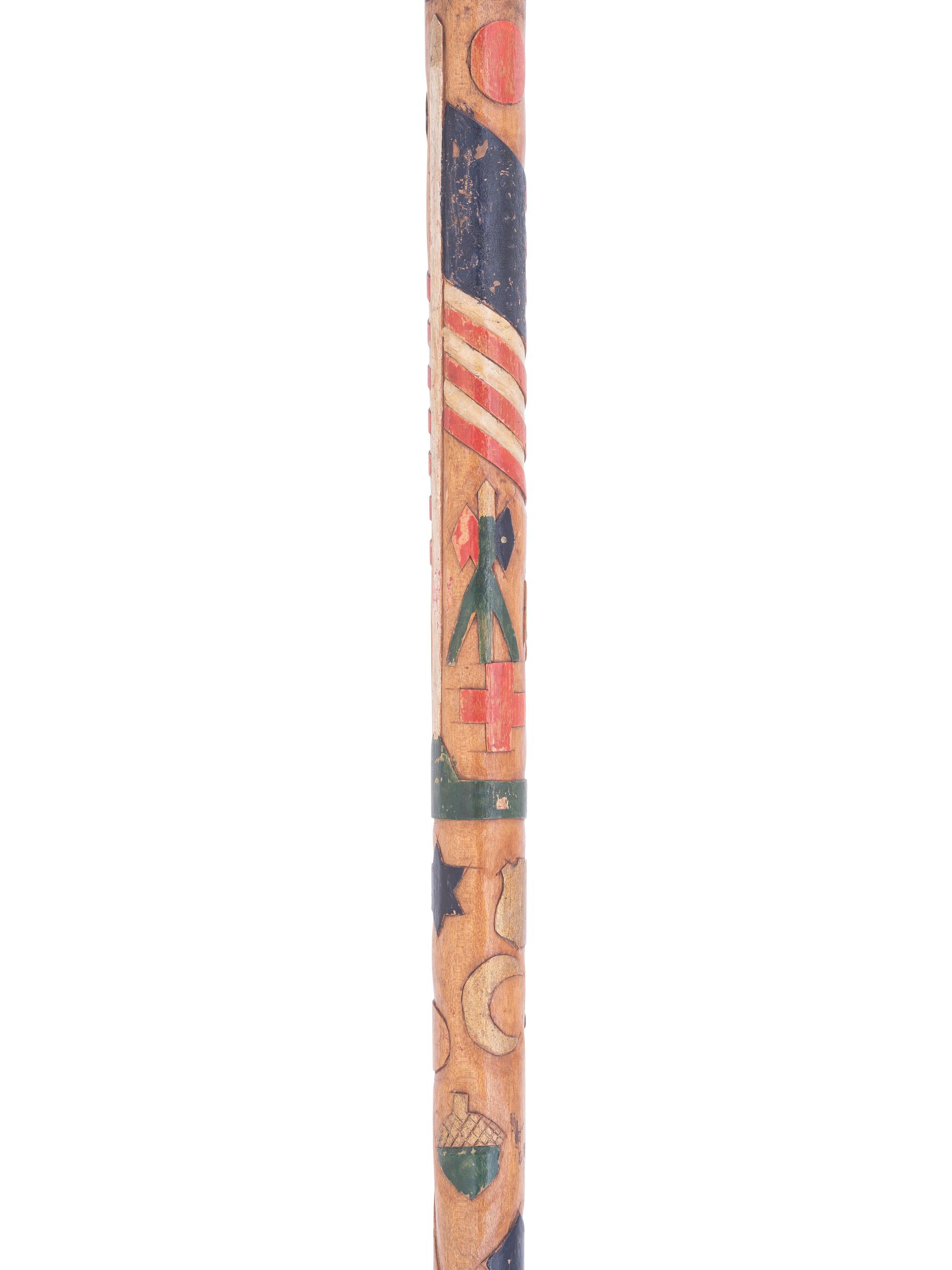 [CIVIL WAR]. Folk-art carved polychrome walking stick with patriotic motifs, incl. Army Corps badges.