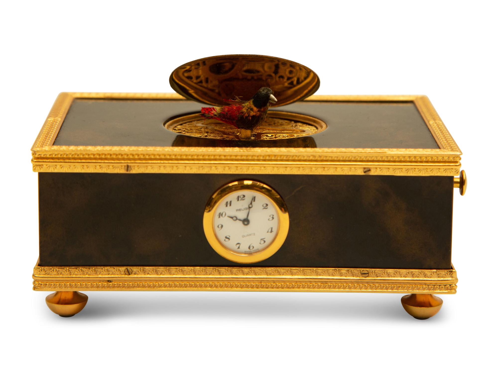 A Swiss Reuge Music Box with Bird Automaton and Clock — 20th Century