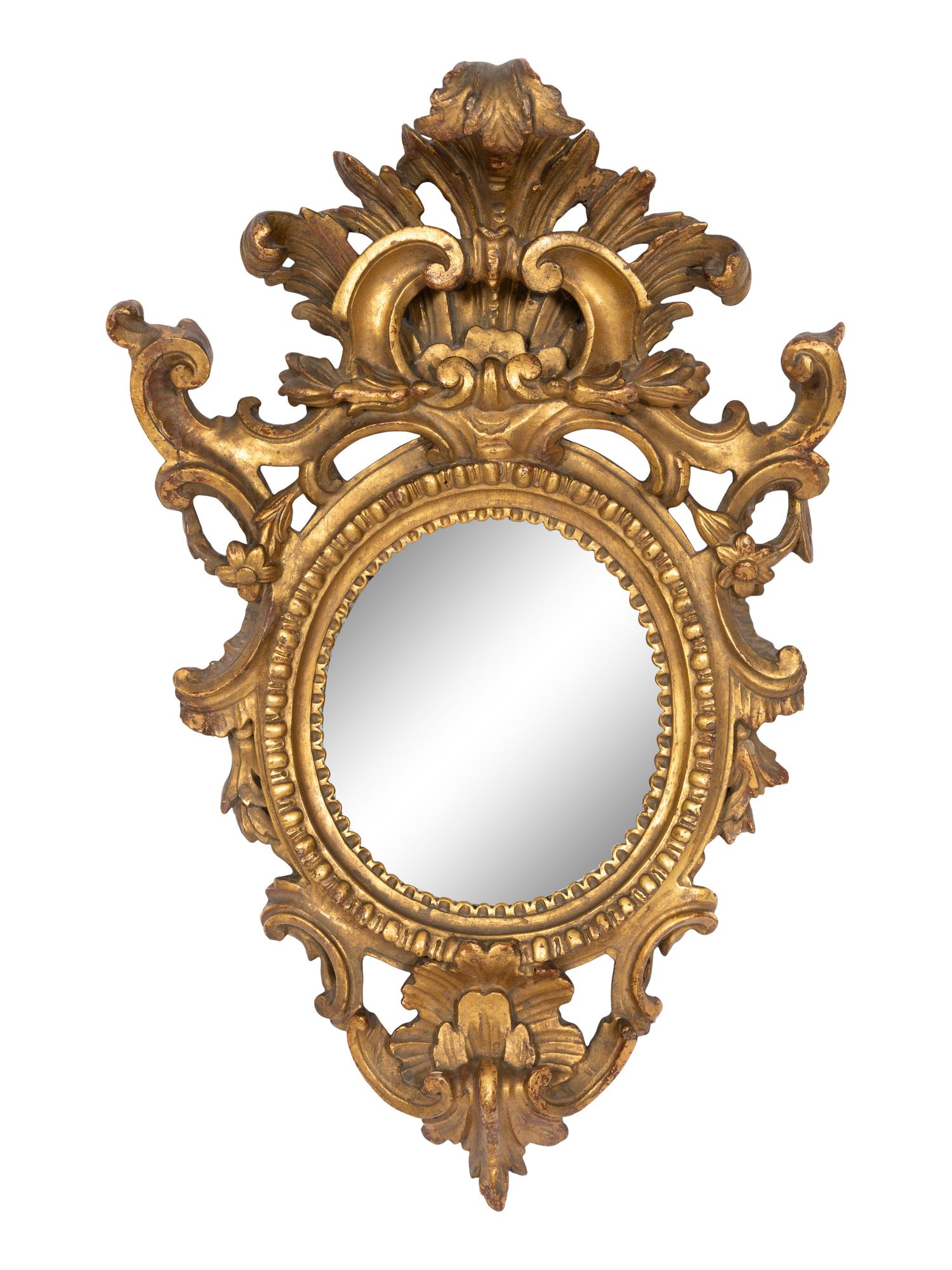 A Pair of Italian Baroque Oval Giltwood Mirrors