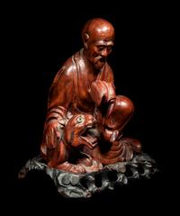 A Chinese Longyan / Lychee Wood Figure of a Luohan