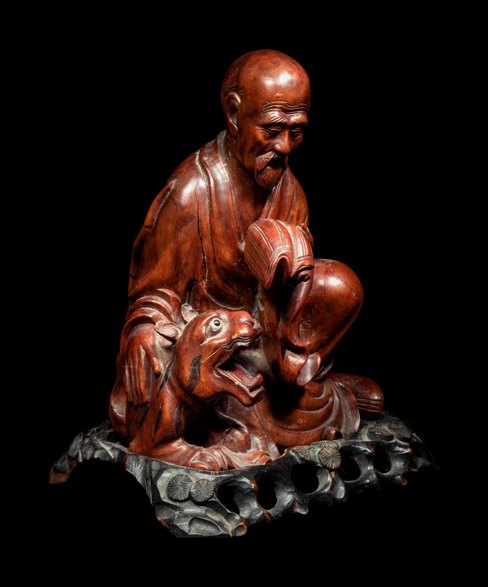 A Chinese Longyan / Lychee Wood Figure of a Luohan
