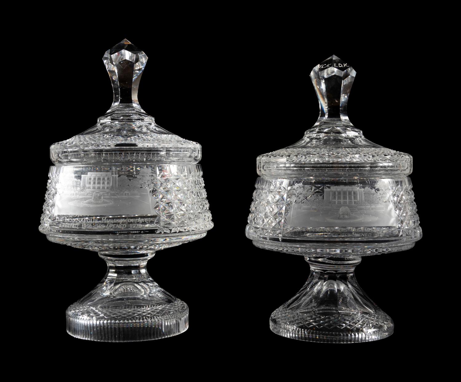 A Near Pair of Cut and Etched Glass Commemorative Covered Urns