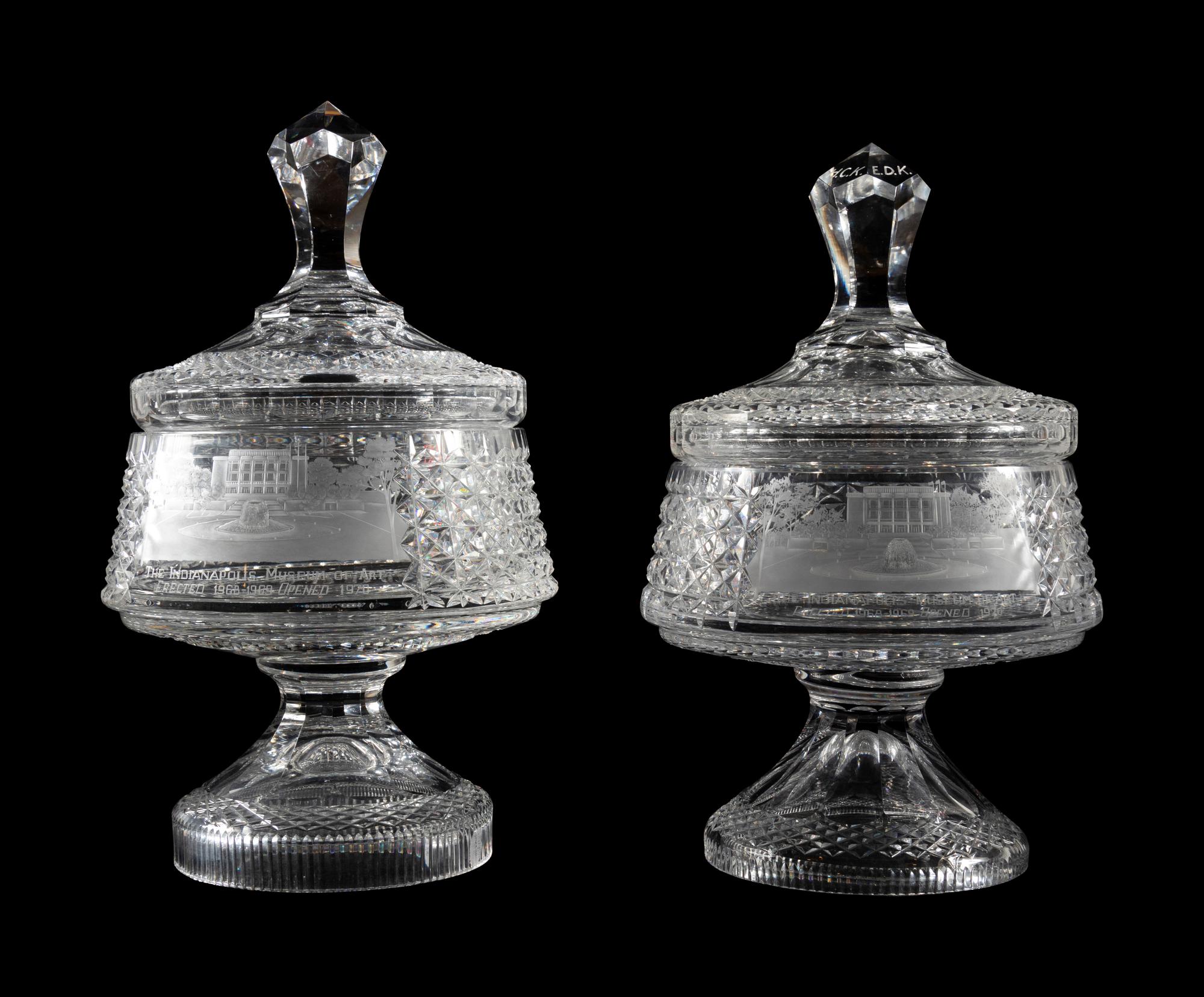 A Near Pair of Cut and Etched Glass Commemorative Covered Urns