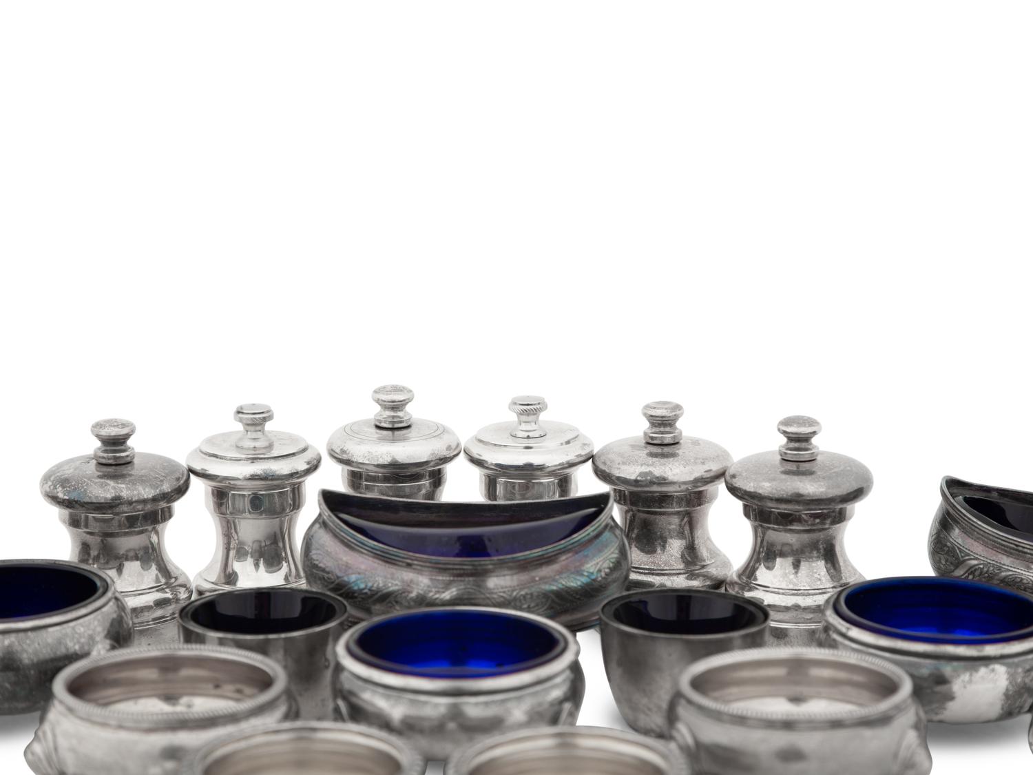 A Collection of Silver Pepper Mills and Salt Cellars