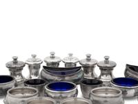 A Collection of Silver Pepper Mills and Salt Cellars
