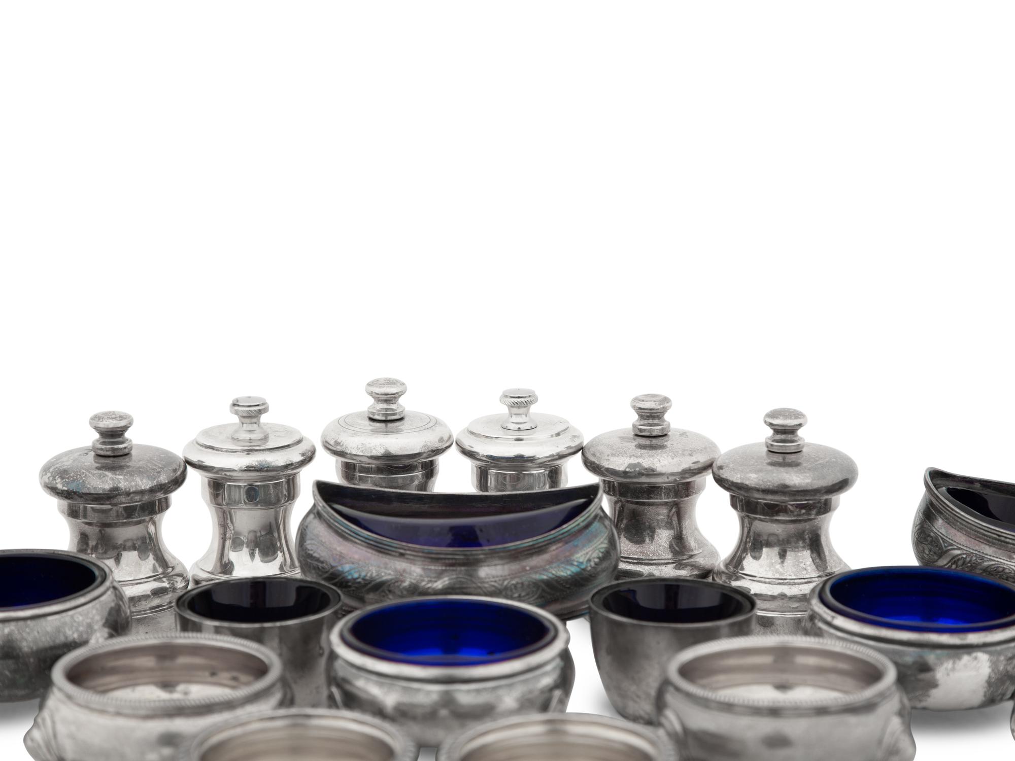 A Collection of Silver Pepper Mills and Salt Cellars