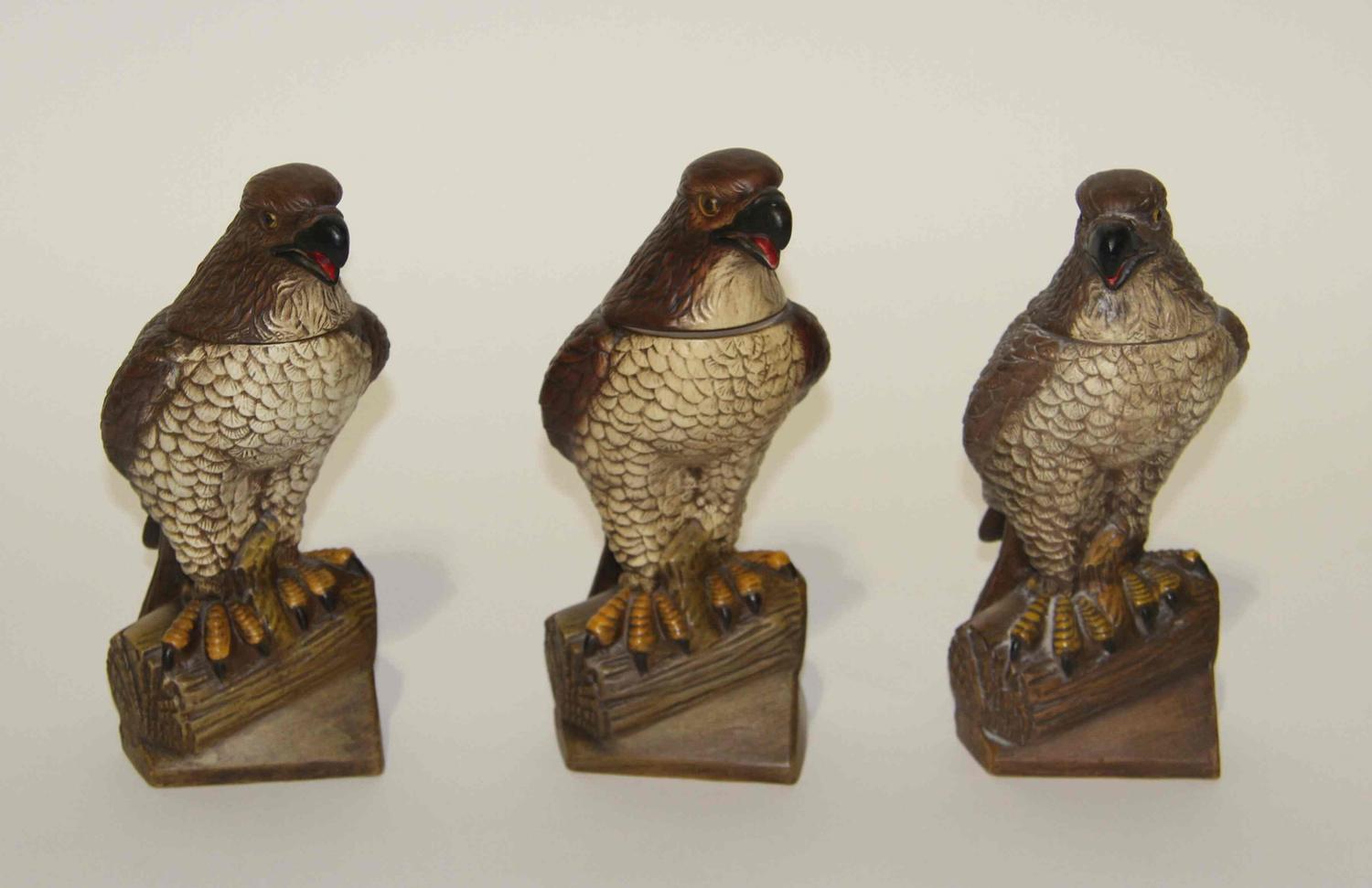 Three Figural Pottery Bottles Height 10 inches.