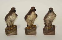 Three Figural Pottery Bottles Height 10 inches.