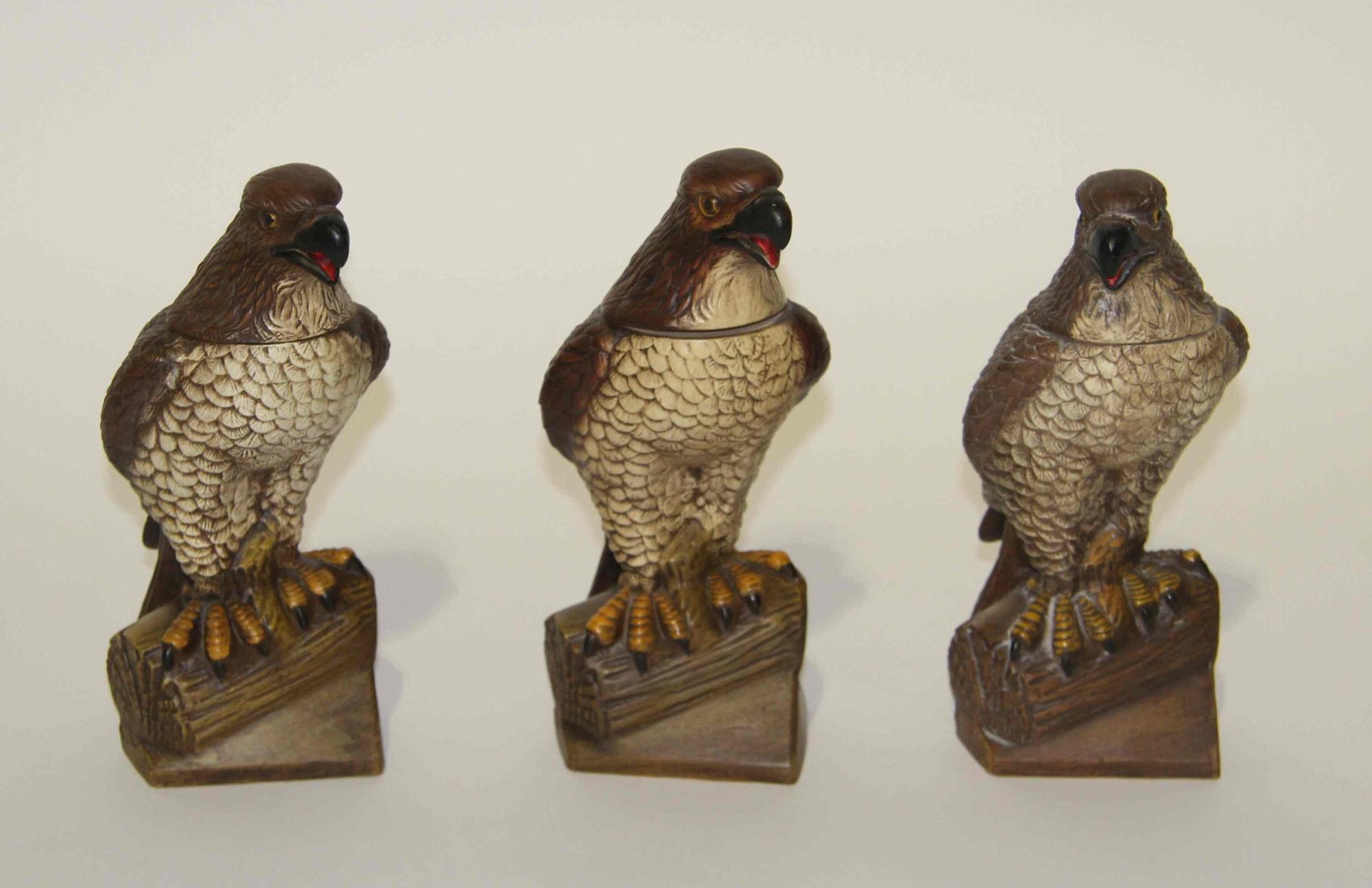 Three Figural Pottery Bottles Height 10 inches.
