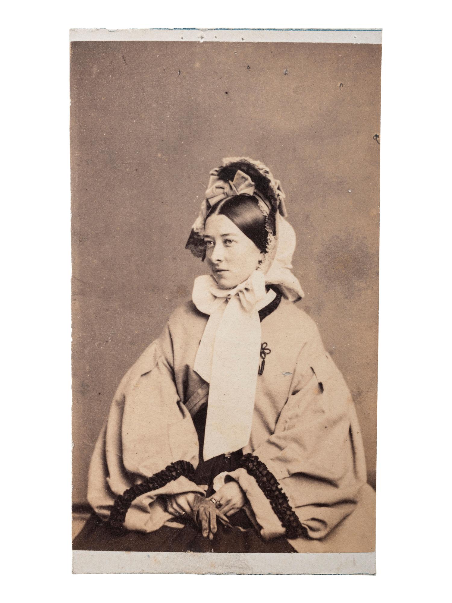 [EARLY PHOTOGRAPHY]. FREDRICKS, C.D., photographer. A group of 2 CDVs of actress Emma Webb, incl. image taken with young African American subject. New York, n.d.