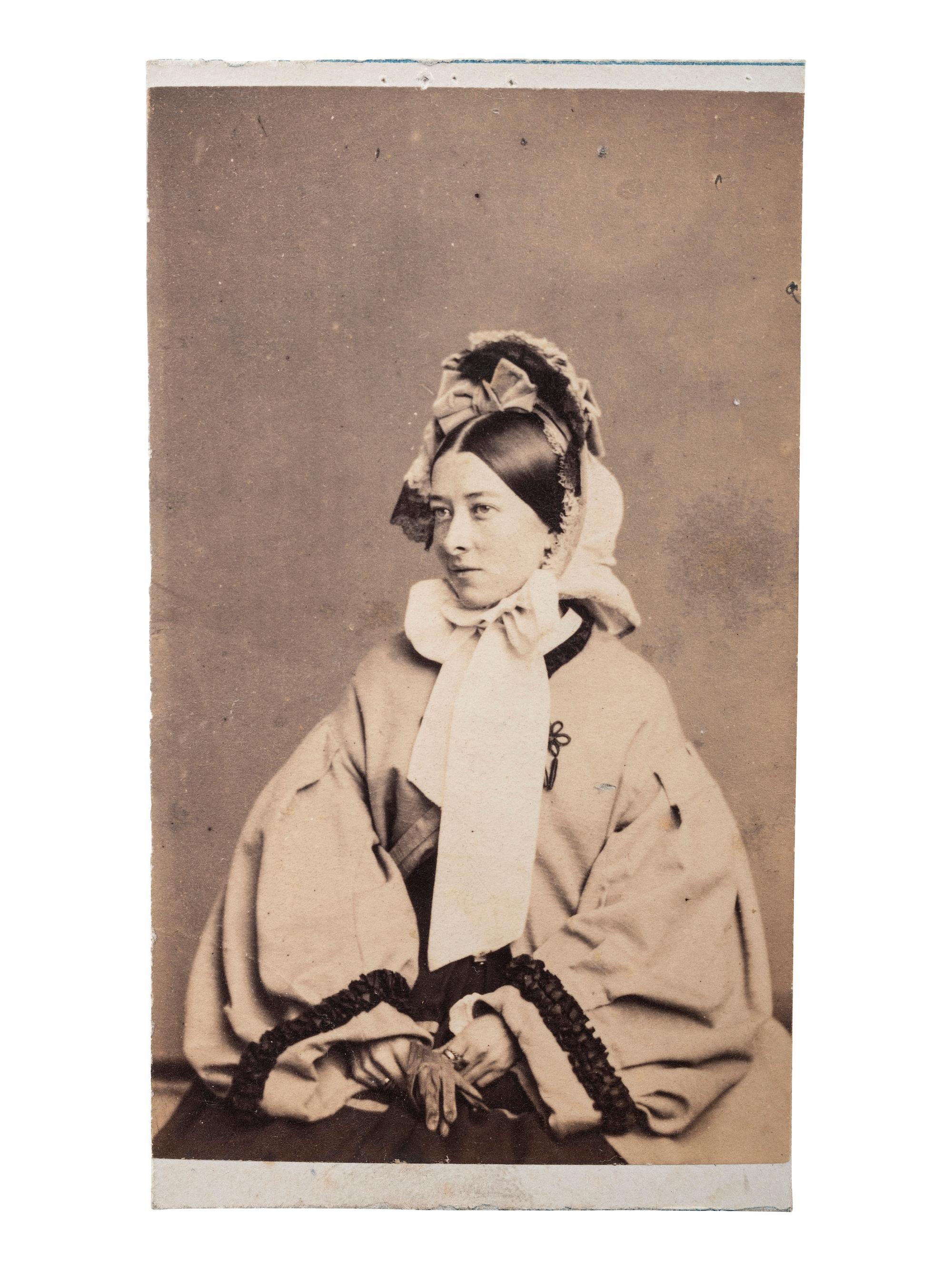 [EARLY PHOTOGRAPHY]. FREDRICKS, C.D., photographer. A group of 2 CDVs of actress Emma Webb, incl. image taken with young African American subject. New York, n.d.