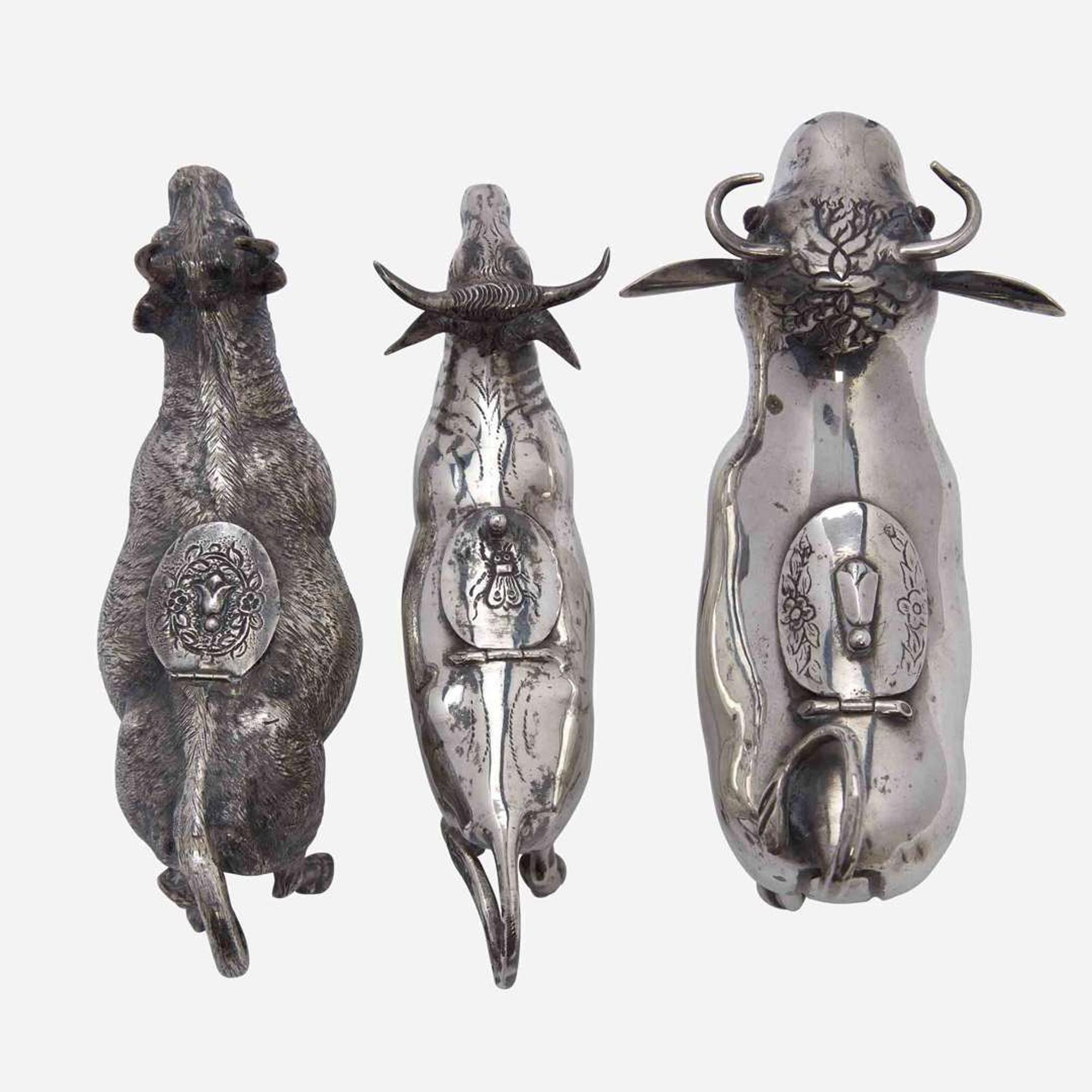 A group of three Continental silver cow creamers 19th / early 20th century