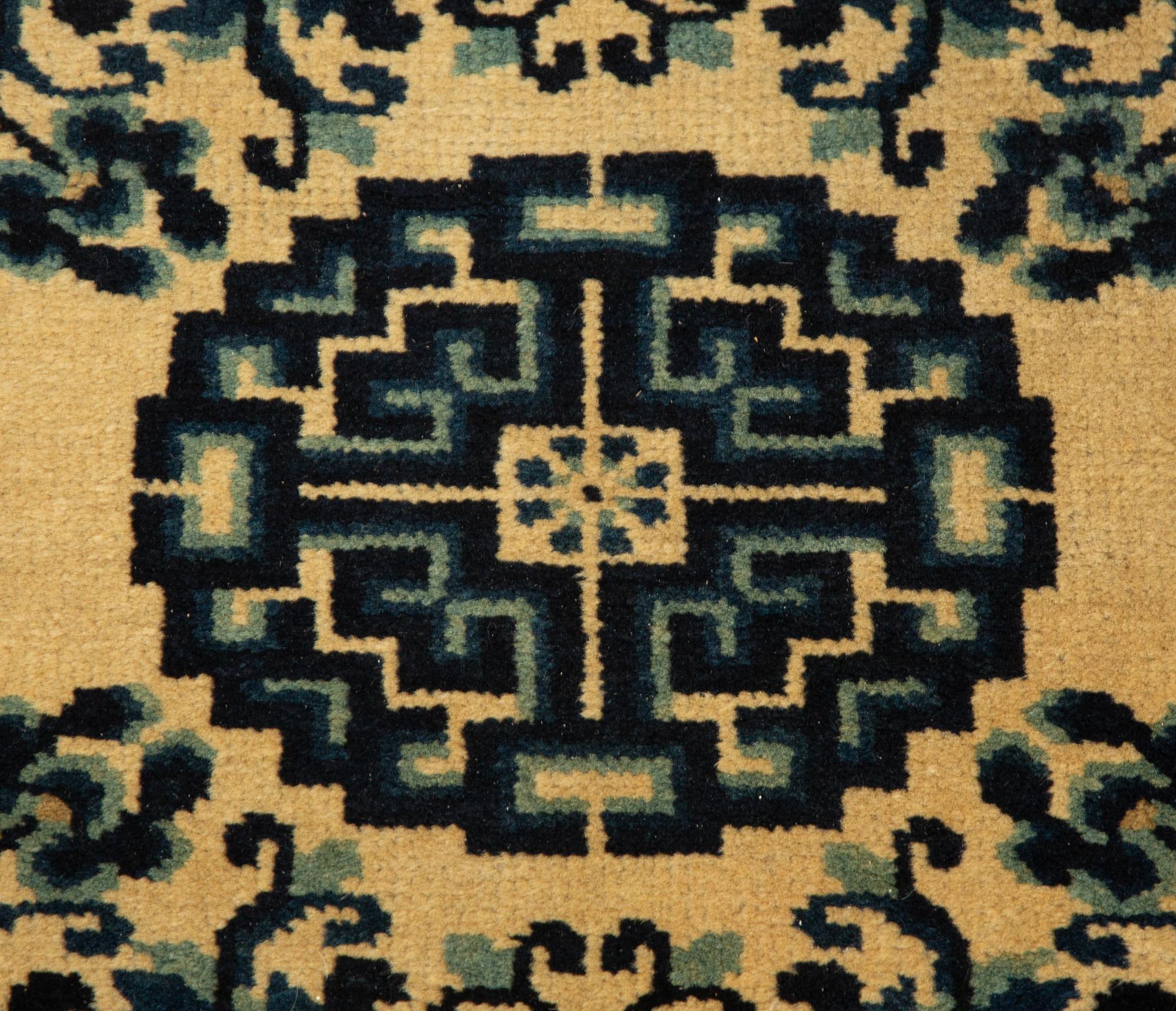 A Group of Four Chinese Rugs