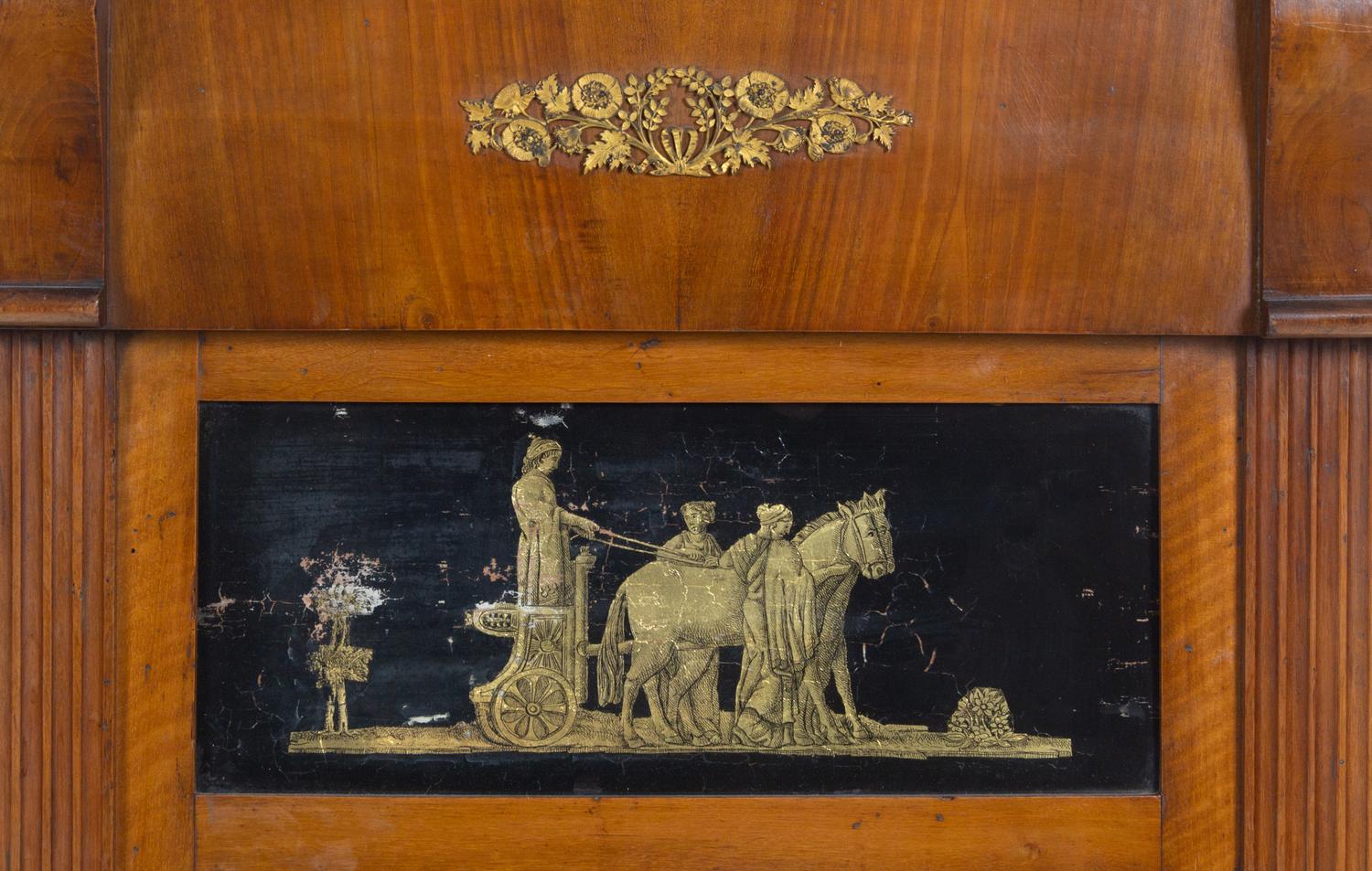 A Continental Reverse-Painted Glass-Inset Walnut Mirror