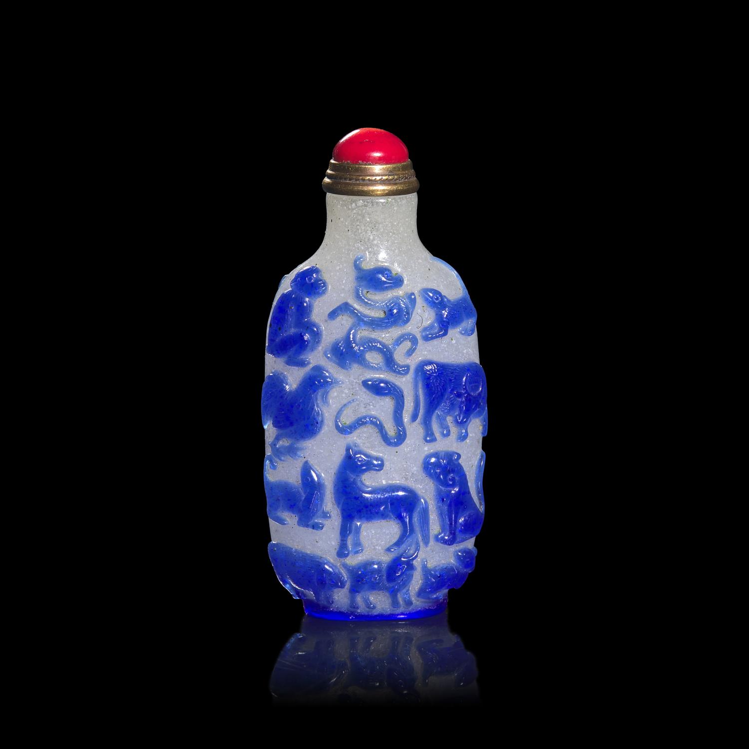 A Chinese Blue Overlay Snowflake Ground Glass "Zodiac" Snuff Bottle