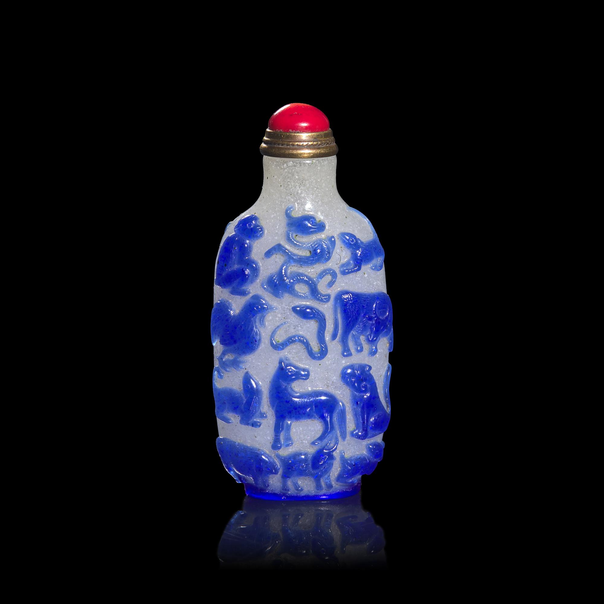 A Chinese Blue Overlay Snowflake Ground Glass "Zodiac" Snuff Bottle
