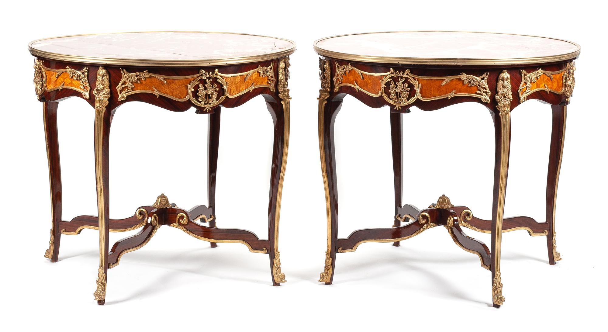 A Pair of Louis XV Style Gilt Bronze Mounted Parquetry Gueridons Height 31 x diameter of top 35 inches.