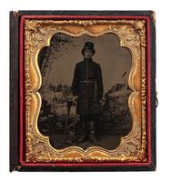 [CIVIL WAR]. Sixth plate tintype of Union bandsman with horn, posed in front of Benton Barracks studio backdrop. [St. Louis, Missouri]: n.p., [1860s].