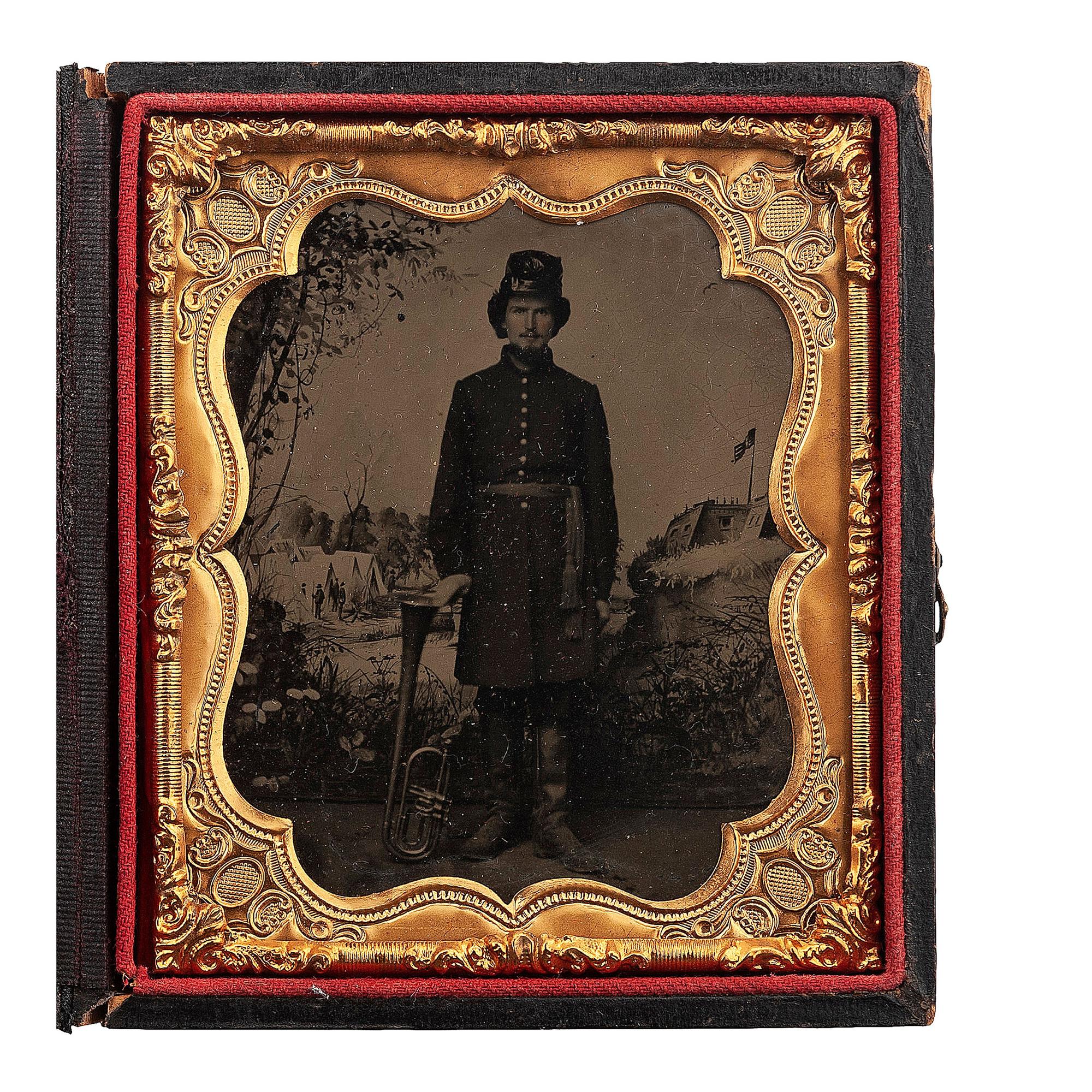 [CIVIL WAR]. Sixth plate tintype of Union bandsman with horn, posed in front of Benton Barracks studio backdrop. [St. Louis, Missouri]: n.p., [1860s].