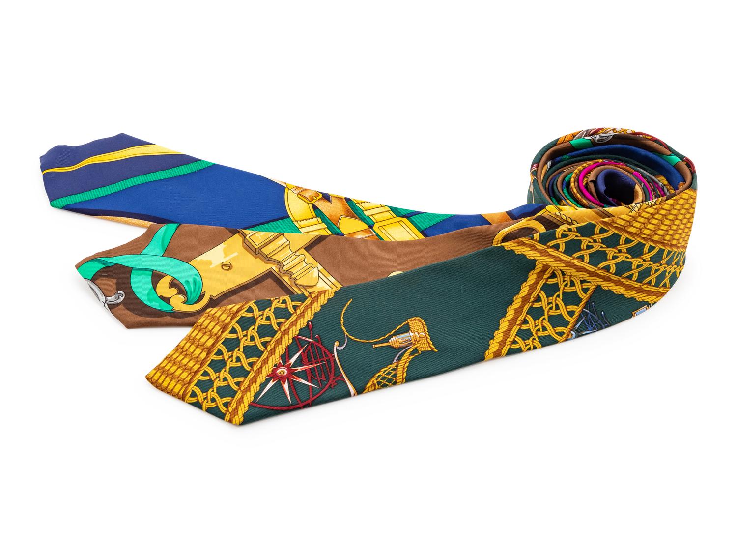 Three Hermes silk ties, one blue with green and yellow pattern, one brown, one dark green
