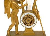 An Empire Gilt Bronze Figural Mantel Clock