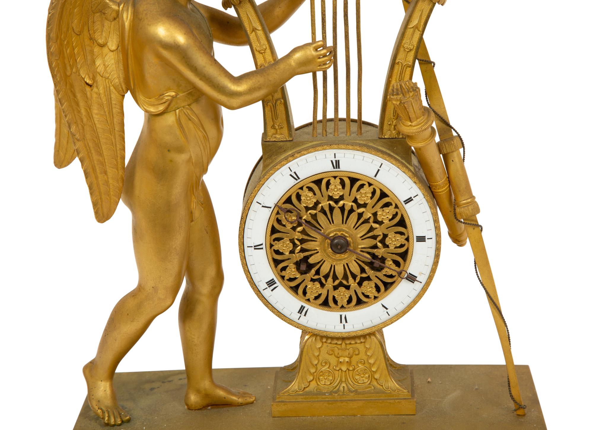 An Empire Gilt Bronze Figural Mantel Clock