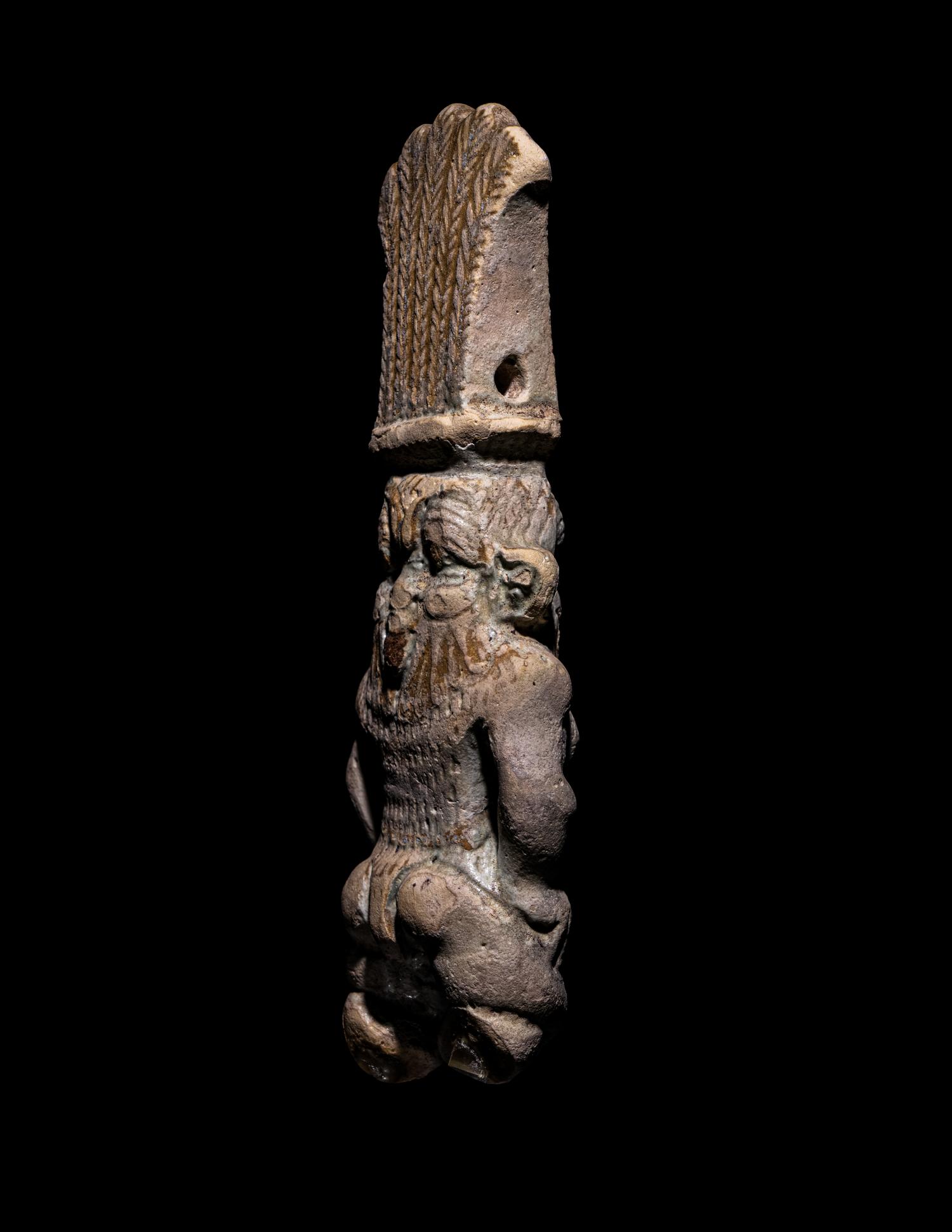 An Egyptian Bichrome Faience Double-Sided Bes