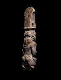 An Egyptian Bichrome Faience Double-Sided Bes