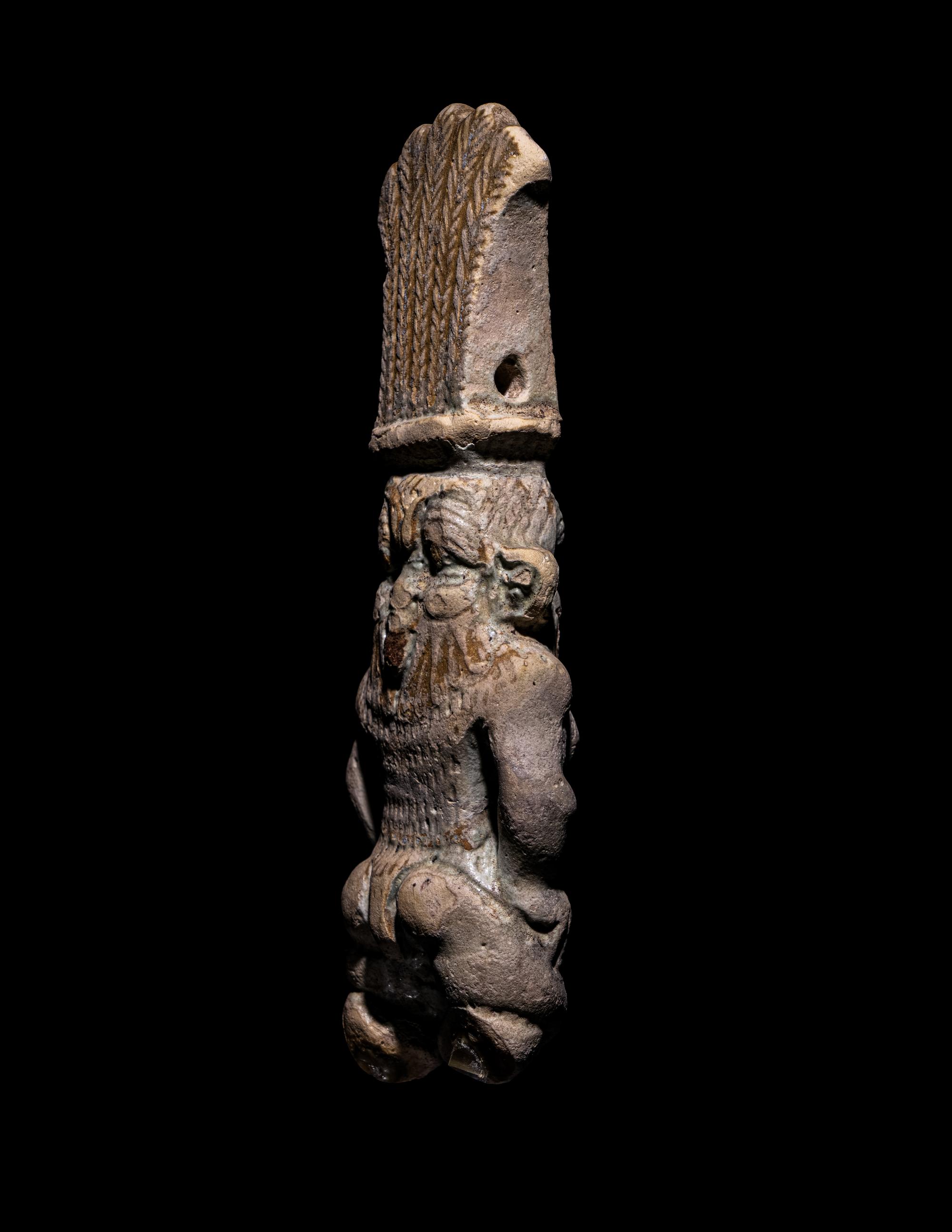 An Egyptian Bichrome Faience Double-Sided Bes