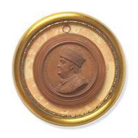 Jean-Baptiste Nini (Italian, 1717-1786), A Terracotta Portrait Medallion of Benjamin Franklin with Fur Hat