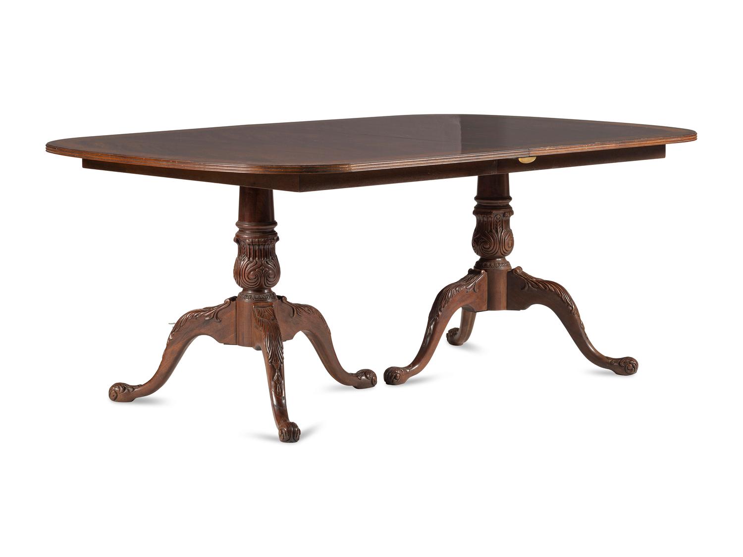 A George III Style Carved Mahogany and Satinwood Dining Table