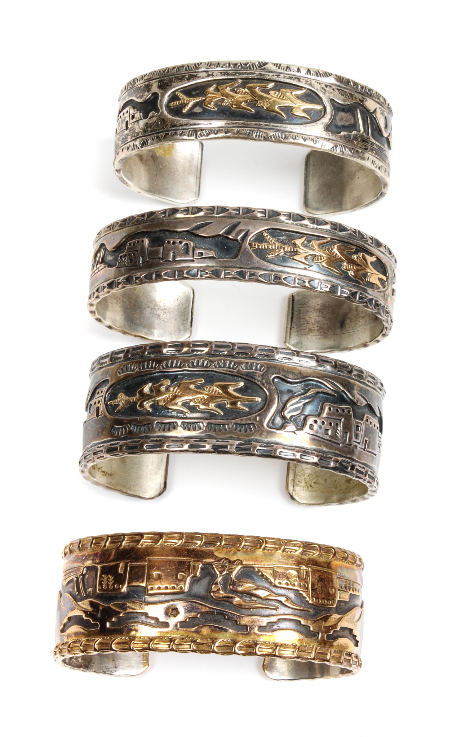 Four Southwestern Silver Storyteller Bracelets Length of one 6 x opening 7/8 x width 5/8 inches