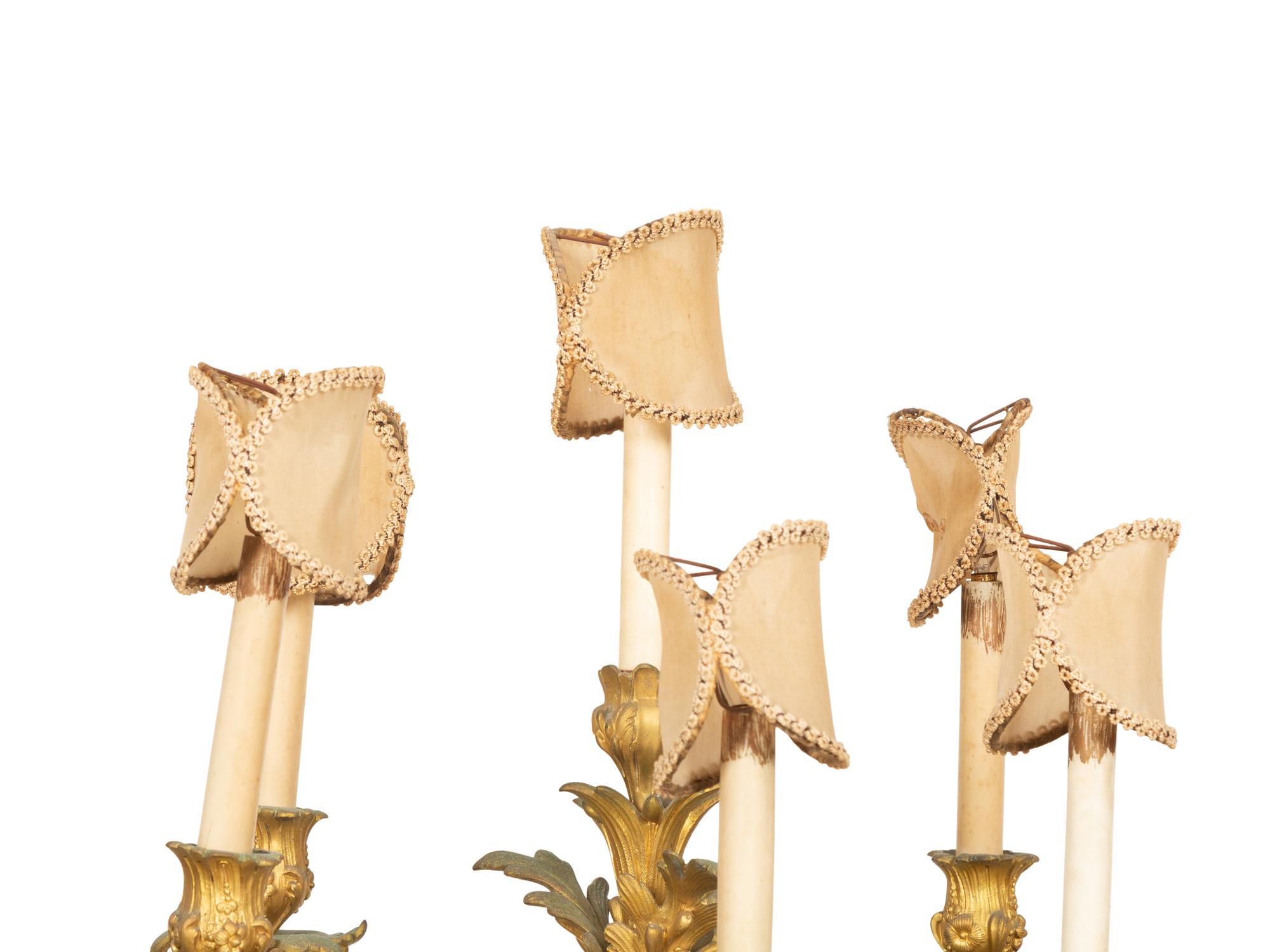 A Pair of Louis XV Style Gilt and Patinated Bronze Figural Six-Light Candelabra