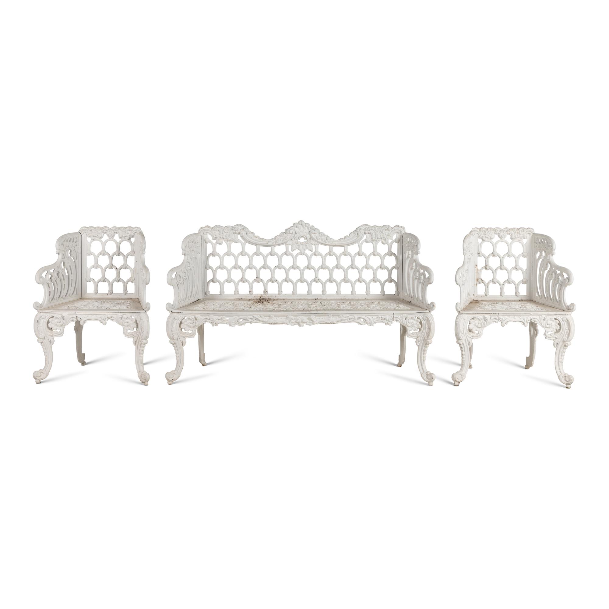 A White-Painted Cast Iron Three-Piece Garden Seating Suite