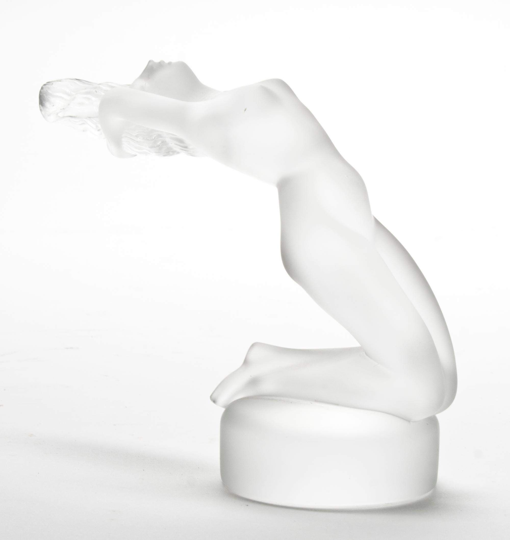 A Lalique Glass Figural Hood Ornament Height 5 1/2 inches.