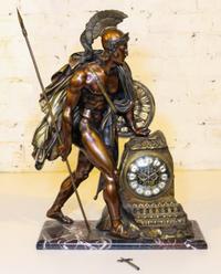 A Continental Gilt Metal Marble Figural Mantle Clock. Height 21 1/4 inches.