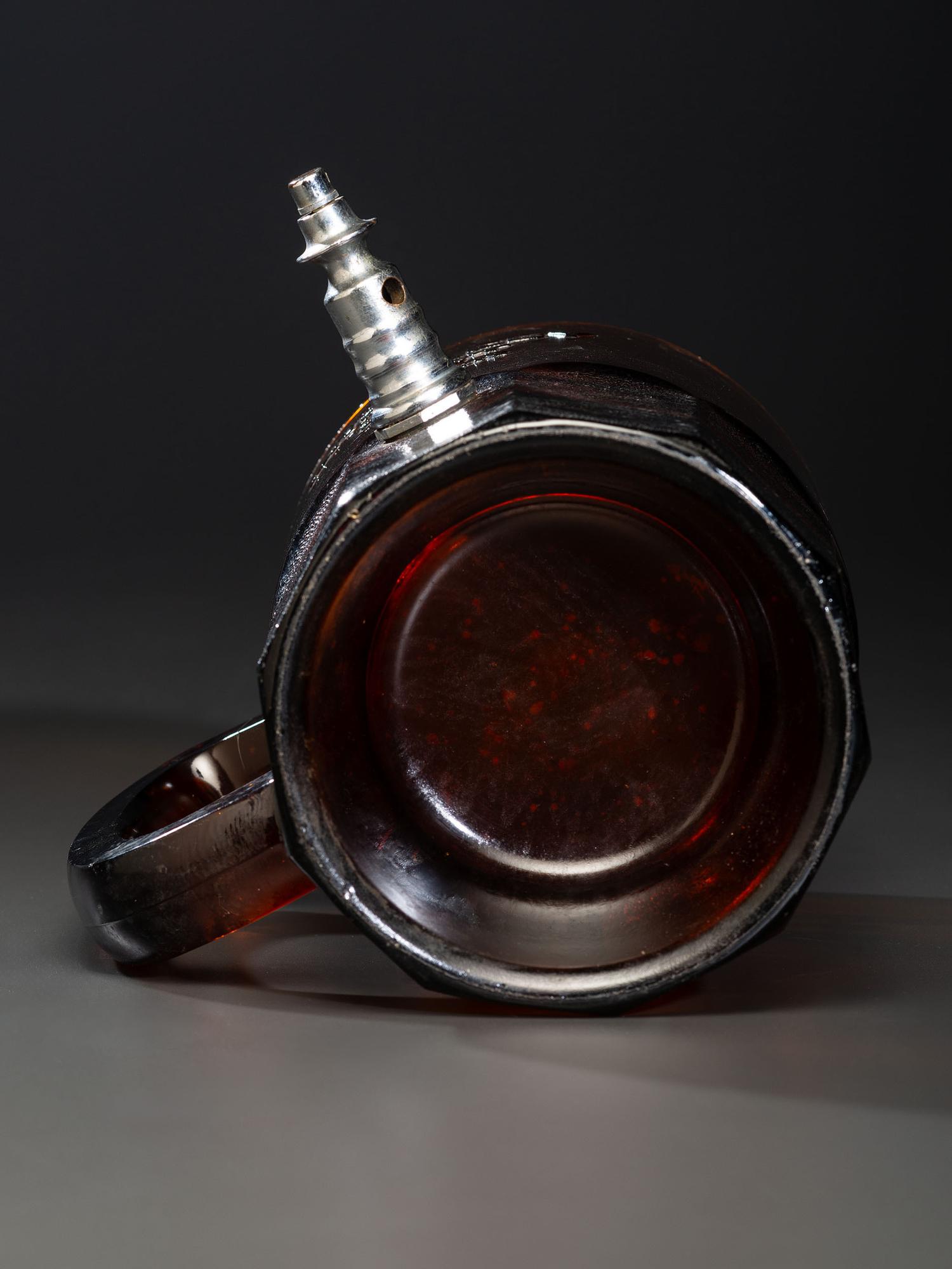 A 'Middleby Root Beer' Glass Countertop Syrup Dispenser